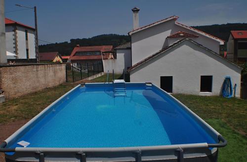 a swimming pool in the yard of a house at Casa da tía María , Razo , Costa da Morte in Razo da Costa