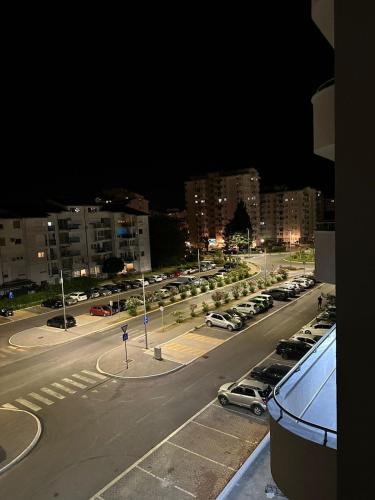 a view of a parking lot at night with cars parked at Aurora Mare in Bar