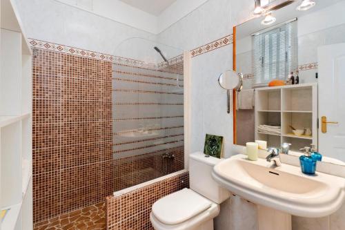 a bathroom with a sink and a toilet and a shower at pardelo in Adeje