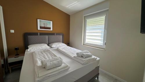 Postel nebo postele na pokoji v ubytování Neretva Apartments