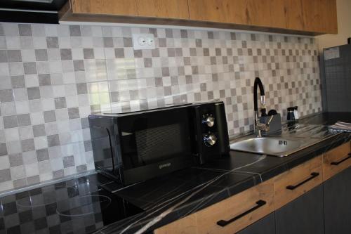 Kuchyň nebo kuchyňský kout v ubytování Neretva Apartments