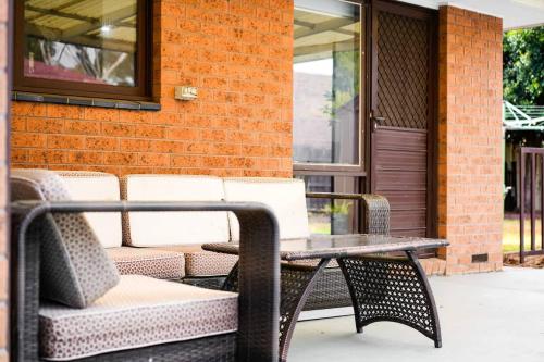 a table and chairs sitting on a patio at Simple Comfort in Altona Meadows in Altona Meadows