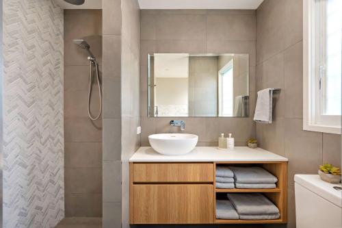 a bathroom with a sink and a mirror at The Lookout in Corlette