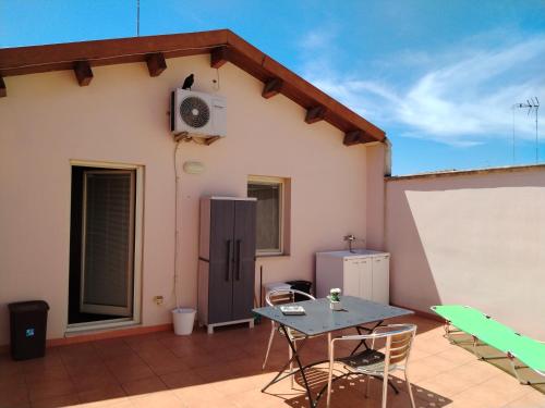 Φωτογραφία από το άλμπουμ του Mansarda con terrazzo privato στη Μπαρλέτα