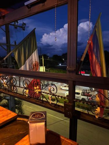 a window with a view of a street and traffic at Estrato6 Apart Studios in Villanueva