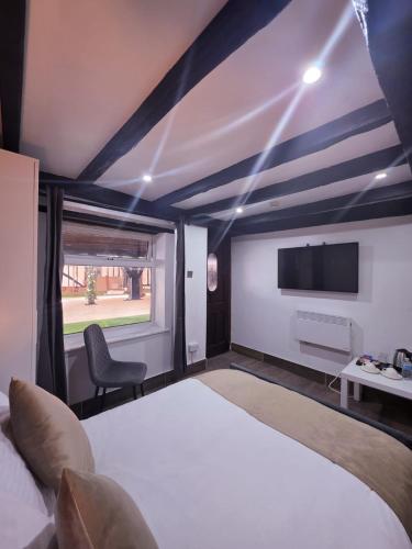 Cama o camas de una habitación en The Courtyard Lodge
