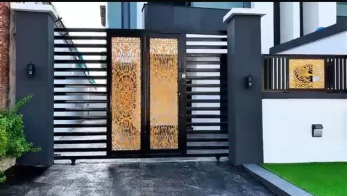 a pair of doors on a house with stairs at Sohana Homes in Ikeja
