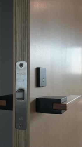 an apple card dispenser on a wall in a bathroom at Good Wood House Higashikawa in Higashikawa