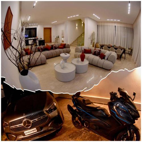 a living room with a motorcycle parked in a living room at Villa À Kenza marrakech in Oulad Akkou