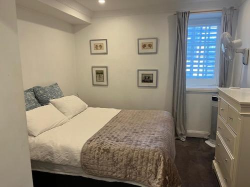 a bedroom with a bed and a window at Wenlock in Sydney