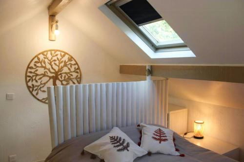 a bedroom with a canopy bed with a skylight at 17Th Century Renovated Barn In Valdeblore in Valdeblore