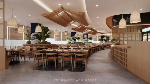 a restaurant with tables and chairs in a room at Apec Mandala Hải Dương in Hải Dương
