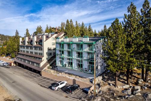 an apartment building with cars parked in front of it at Alpine Haven condo in Stateline
