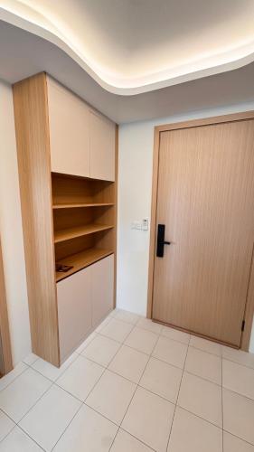 an empty room with a door and a tiled floor at Fantasea Condo Kamala beach 1BR apart B1 in Kamala Beach