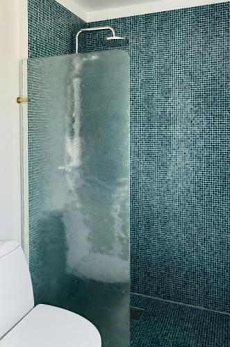 a bathroom with a glass shower with a toilet at Modern Summer House On Stunning 3700 M2 Plot in Frederiksværk