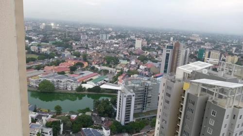 an aerial view of a city with buildings and a river at Colombo, Trizen Luxury Apartments, Sri Lanka in Colombo