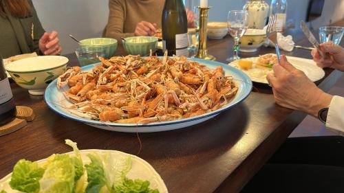 a table with a large plate of crabs on it at Hotel Møllehuset in Hadsund