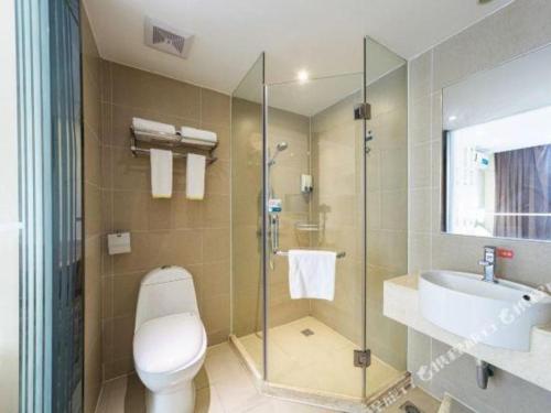 a bathroom with a toilet and a sink and a shower at City Comfort Inn Changsha Wanjiali Mawangdui Metro Station in Changsha