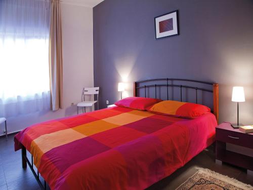 A bed or beds in a room at Apartments Bozena