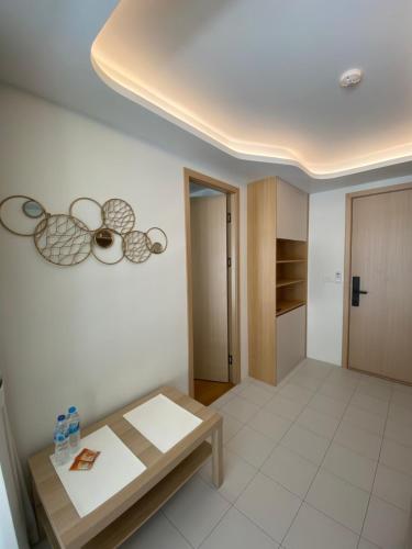 a living room with a table and a kitchen at Fantasea Condo Kamala beach 1BR apart B1 in Kamala Beach