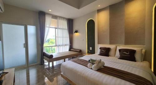 Postel nebo postele na pokoji v ubytování Nanlamoon Hotel