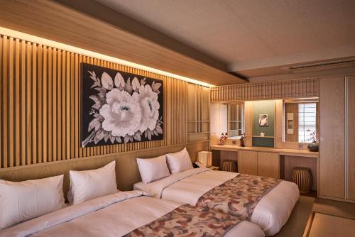 Postel nebo postele na pokoji v ubytování Hoshikage Ryokan Hotel