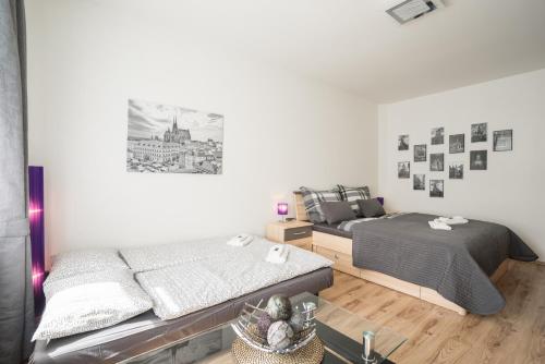 Кровать или кровати в номере Čajkovskij Apartments