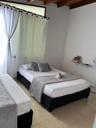 Cama o camas de una habitación en Casa Hotel Argenta