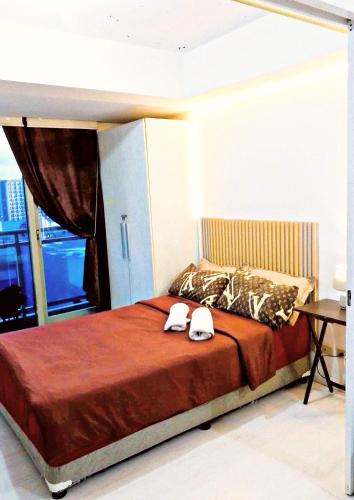 Ένα ή περισσότερα κρεβάτια σε δωμάτιο στο Azure Staycation 1 bedroom can fit 2 to 4Pax