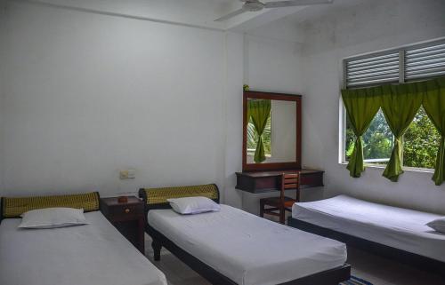 Postel nebo postele na pokoji v ubytování Mami Resort