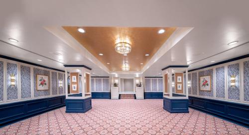 a large room with blue walls and a red carpet at Willard InterContinental Washington by IHG in Washington