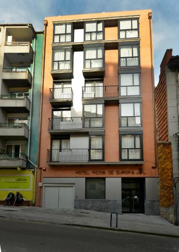 an apartment building on the corner of a street at Hotel Picos De Europa in Santander