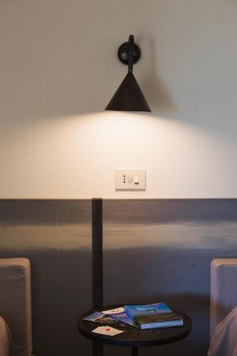 a lamp on a table in a room at Agriturismo La Facenda in Albinia