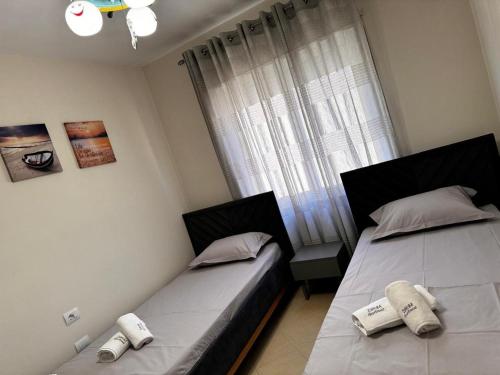 מיטה או מיטות בחדר ב-ZaYoM Apartment
