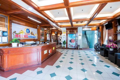 a restaurant lobby with a reception counter at Dancenter Super Cowboy Hotel Melaka in Melaka