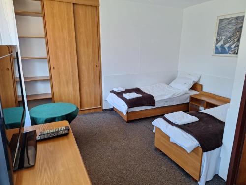 Postel nebo postele na pokoji v ubytování Ośrodek Edukacji Leśnej LEŚNIK w Zakopanem