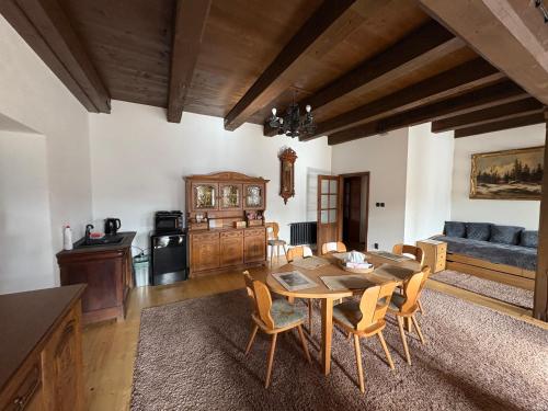 a kitchen and dining room with a table and chairs at Feltlův mlýn v Borovnici in Borovnice