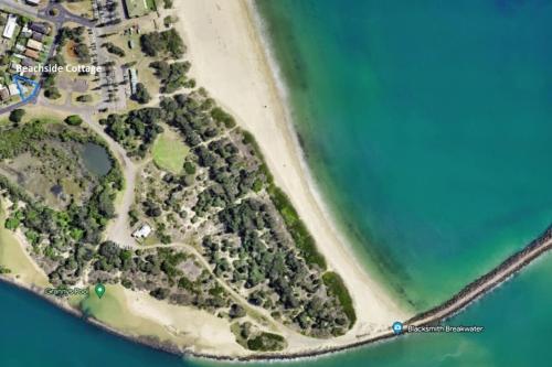 an aerial view of an island in the ocean at Beachside Cottage at Blacksmiths in Blacksmiths