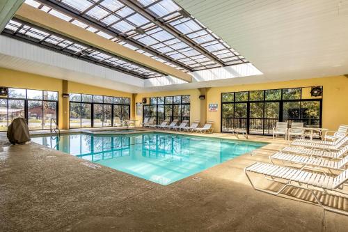 a large indoor pool with chairs at Quality Inn Perry - National Fairgrounds Area in Perry