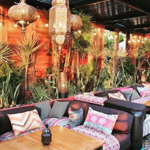 a room with couches and a table and plants at Sea Suite Villa in Chaweng