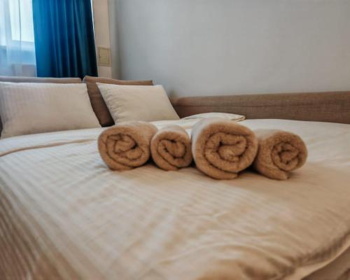 a group of donuts sitting on top of a bed at My-RIN in Otopeni