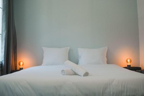 Postel nebo postele na pokoji v ubytování La Maison sur la Loire À deux pas du cœur de Tours