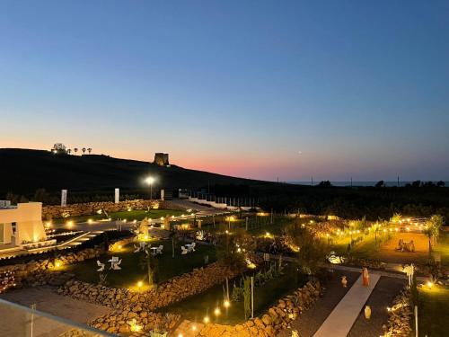 a view of a parking lot at night at Cantine De Mare - Wine and Resort in Cirò Marina