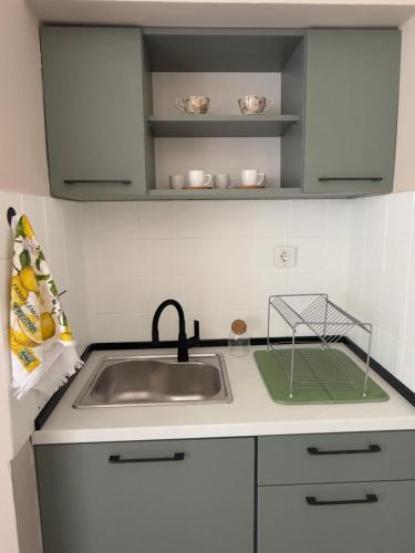 a kitchen with a sink and a counter top at KudevApartment1 in Nesebar