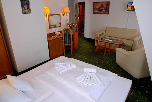 Posteľ alebo postele v izbe v ubytovaní Hotel Spindlerova Bouda