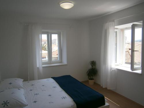 Posteľ alebo postele v izbe v ubytovaní Apartments An Ni