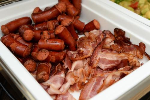 a styrofoam container filled with hot dogs and bacon at Alexandar Square Boutique Hotel in Skopje