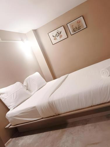 Ένα ή περισσότερα κρεβάτια σε δωμάτιο στο X Rest Inn Yaowarat เรสอินน์ เยาวราช