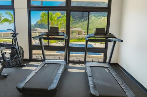 a gym with two treadmills and a treadmill at @Marbella Lane-Pōmaika'i LoveNest Ocean+MT View in Waianae