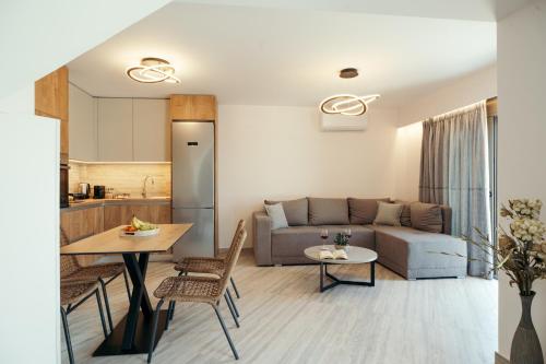 a living room with a couch and a table at DK Luxury Villas in Sivota